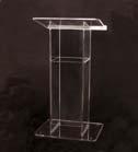 (E) CLEAR Acrylic & Wood Panel Lectern "H" Style with shelf crafted from a durable ½" thick acrylic, with a modern H shape. Top surface is at an angle with a lip for placing presentation materials.