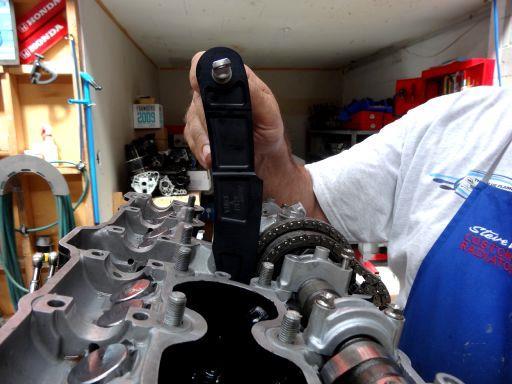 Slide the Vince & Hyde Racing AHM Cam Chain Tensioner down