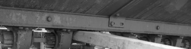 On the left side of the seed bin, loosen the four bolts that hold the seed bin to the frame. DO NOT remove bolts.