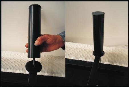 The legs screw into the threaded holes in each corner of the adjustable base frame (See Figure 3).