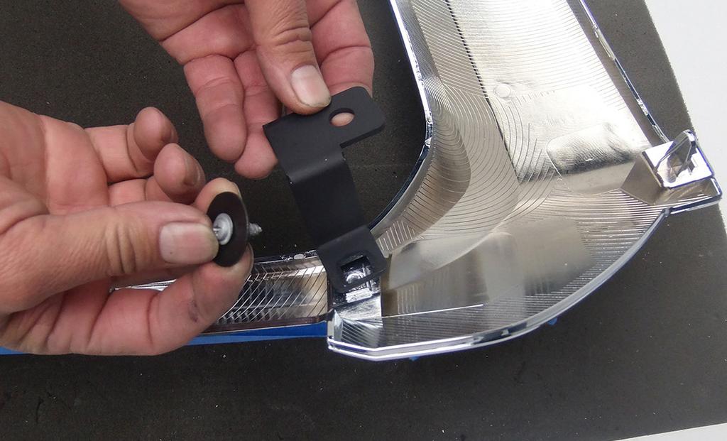 Billet Grille Installation 9. Take the two Z support brackets and install them on backside of the factory grille shell with the arm bending downward as shown (Fig 9).