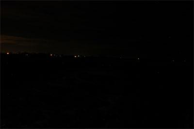 This photo shows an open field illuminated only by ambient light at approximately 9:00 pm`. This photo shows the LED10W-1S, spot, illuminating that field.
