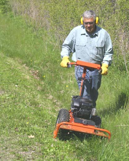 Slopes WHEN OPERATING THE DR SCOUT FIELD and BRUSH MOWER OVER UNEVEN TERRAIN OR SLOPES, USE EXTREME CAUTION NOT TO TIP OVER THE MACHINE.