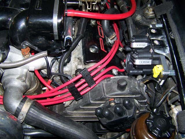 You may route your spark plug wires any way you desire, so long as the connections match the TecGT manual.