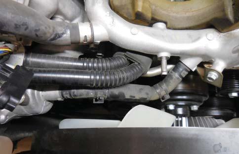 48. Remove the bolt at the front of the coolant