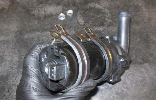 Gather the two Adel clamps and install them on the intercooler pump as shown.