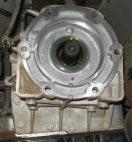 It may be necessary to trim excess RTV that protrudes up from the transmission pan onto the rear face of the transmission.