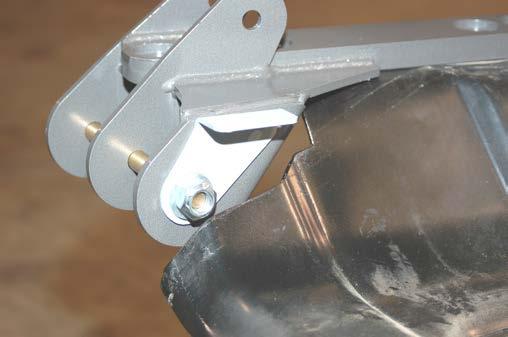On Rubicon Models, the compressor bracket will be installed on the rear lower control arm bolt as shown in Photo 13.