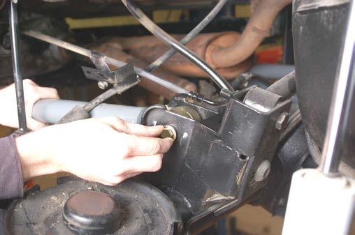 39.Install the upper arm on the axle using the stock hardware. Do not tighten at this time. See Photo 22. 40.