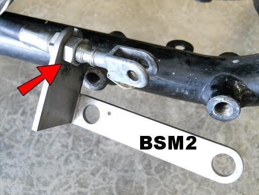 Insert the brake cable and brake light switch cable into the slots of the BSM2 in the same manor you removed them but only finger tighten the nuts, so that you can