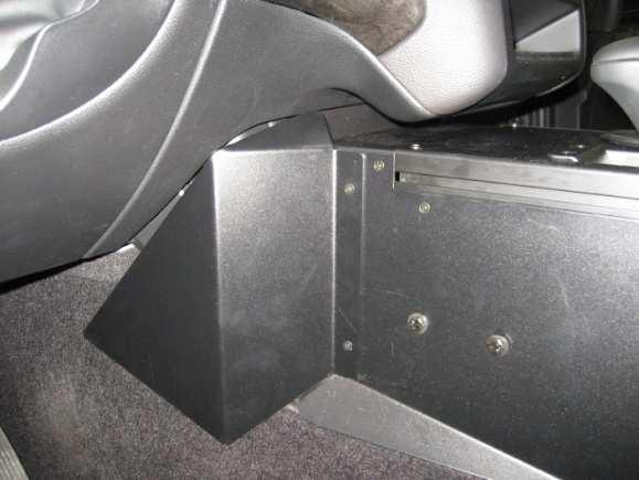(7mm socket) Loosely attach front driver side console housing to lower