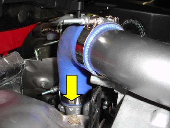 13. Start on the hot side charge piping by taking the 2792N t-bolt clamp and placing it over the small end of the 90 degree silicone reducer.