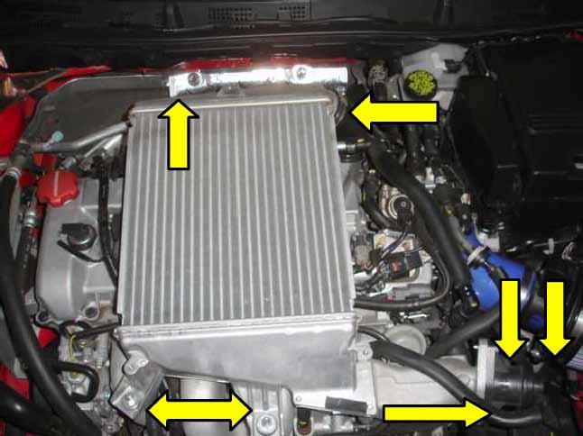 With the bolts removed, lift the front of the cover up and slide it back to release it from the retaining bracket on the rear of the cover. 2.