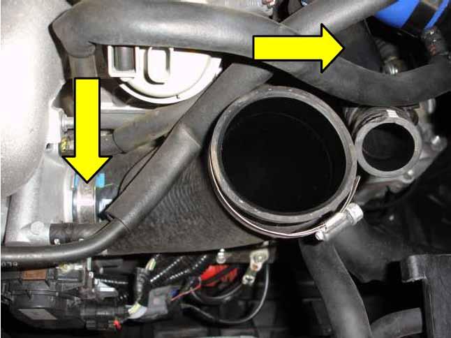 3. With the factory intercooler out of the way you can now completely remove the rubber hose from the throttle body by loosening the 10mm hose clamp.