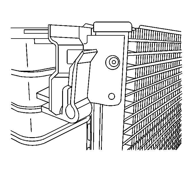 Fig. 104: View Of Condenser Upper Retention Tabs 9. Install the condenser to the radiator. Press down to engage the upper retention tabs. 10. Install the fan assembly to the radiator. 11.