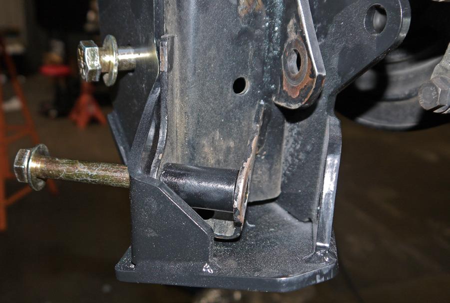 Prep the lower shock/link mounts: If the lower mounts have been hit on rocks dress up the outside of the stock mount so there are no burrs and the new coilover mount will sit flat and install easily.