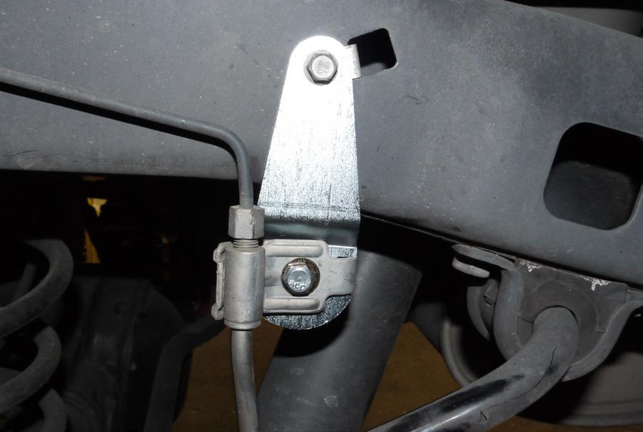 10 FIG.11 26. Install the supplied bump stop spacers with the 5/16 hardware. If vehicle has a track bar lift bracket, a taller bumpstop is required. (1/2, 3/16 Allen) (FIGURE 11) 27.