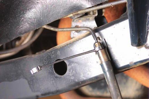 Remove the brake line from the caliper using a 14mm socket. Retain stock hardware to reinstall the brake line. A catch pan is recommended to avoid a fluid mess. See Photo 30. 50.