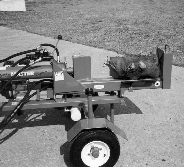 4. Starting: a. Move the machine into its working position next to the wood to be split. b. Set park brake if connected to tow unit. c. Lower the front and rear stands if so equipped.