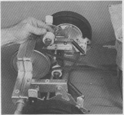rear height adjuster bracket as shown. Slide entire self-propelling mechanism in directio necessary to obtain the proper "V" belt tension. 2.