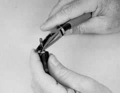 Racer's Tip: You can use your needlenose pliers to gently close the split on one end of the roll pin. This slightly smaller end will then be easier to get started into the roll pin hole.