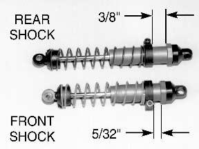 then compress the shock spring and slide one of the #6474 spring cups onto the shaft so that it will slip down over the #7217 black nylon shock rod end.