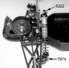 Fig. 137 This photo shows all four shocks installed onto the truck. We have now completed the chassis assembly. Fig. 135 Fig.