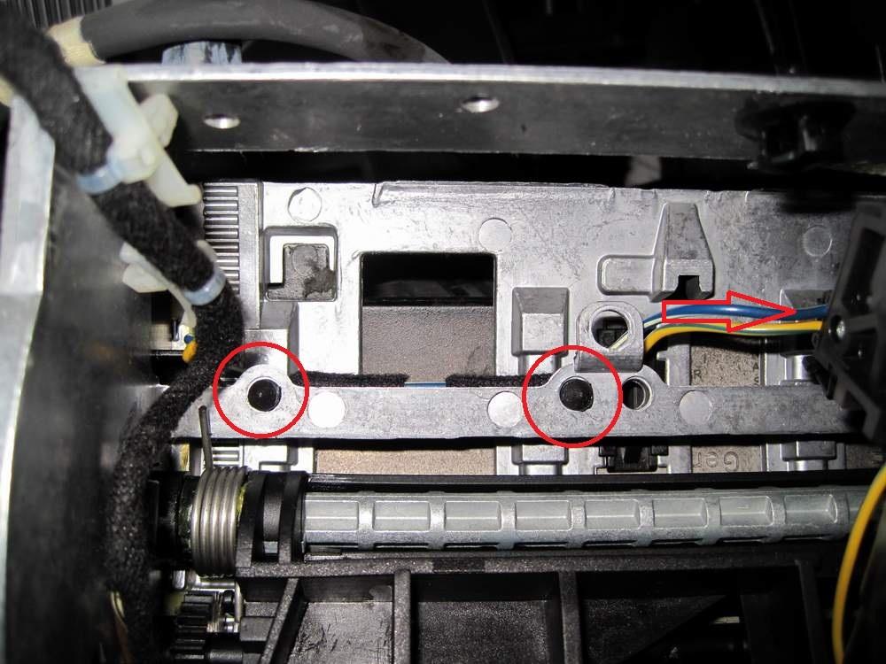 Detach the power cable from the motor (red arrow), and remove the cables from the