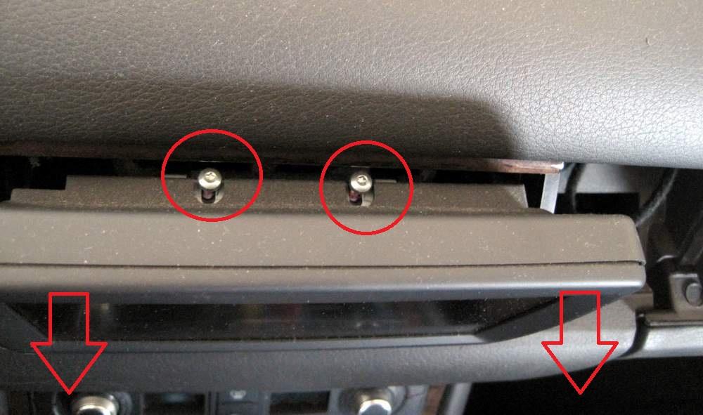 Unscrew the bolts with torx 15 screwdriver, just about same height as you can see in the picture.