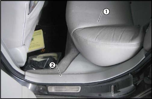 Remove the LHS rear seat cushion (1). 9.