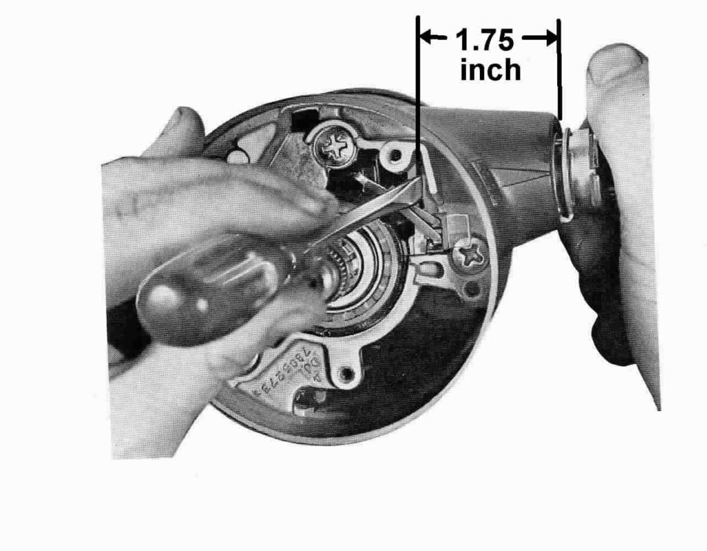 You will need to place the turn signal switch in right turn to access the upper right screw. Unscrew and remove the turn signal lever 1969-76 models.
