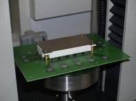 The module is pressed into the PCB with a steady motion.