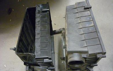 Photograph shows air box before and after
