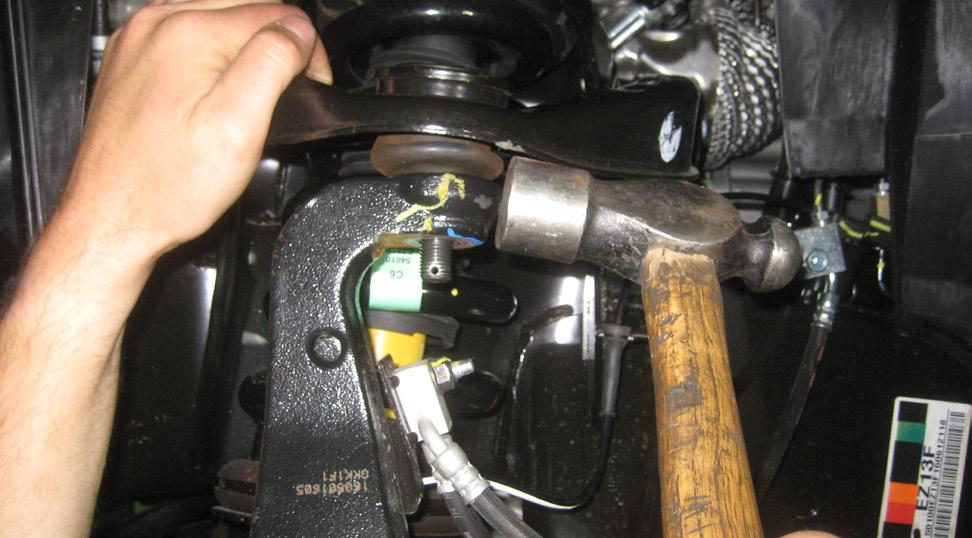 them. 8. Remove the the lower strut mounting bolt and the hardware.
