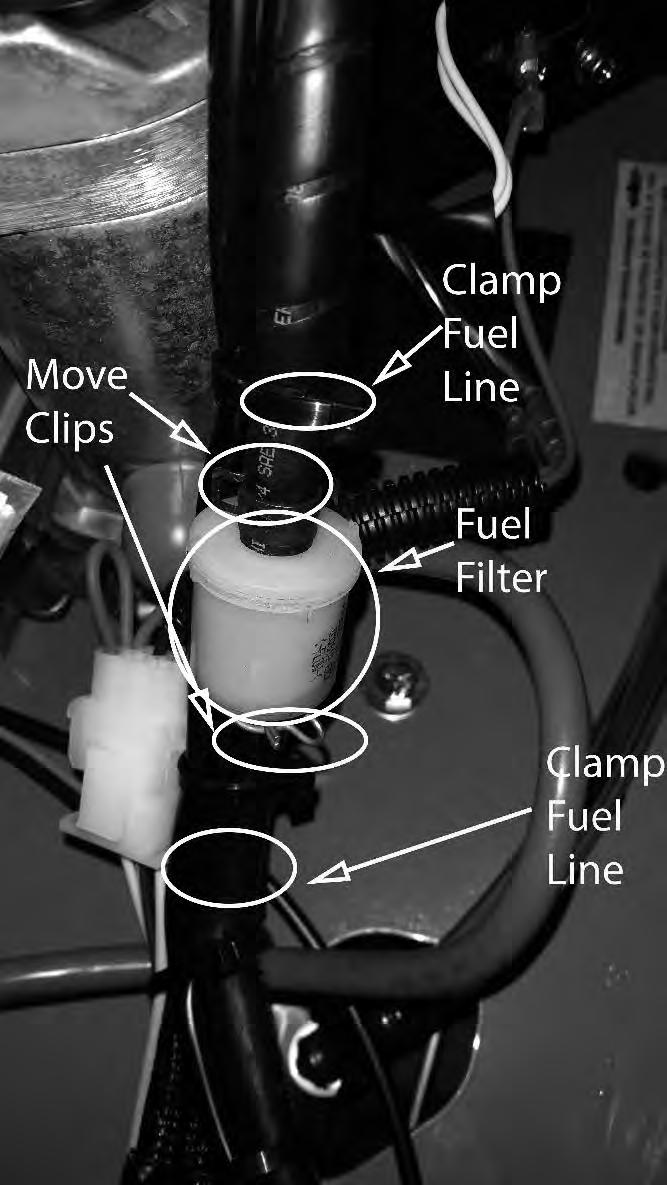 The fuel filter is located in the fuel line on the left side of the engine by the starter motor. Replace the filter yearly.