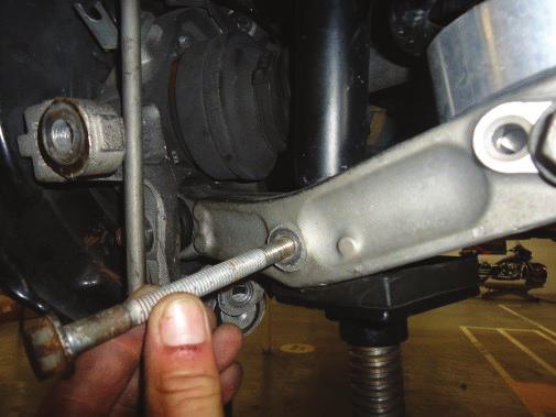 CONTROL ARM TO COMPRESS THE SPRING AND