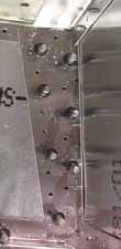 The I/B rivet line is through the Lower Front Longeron 6B10-3, O/B rivet line is 10mm from