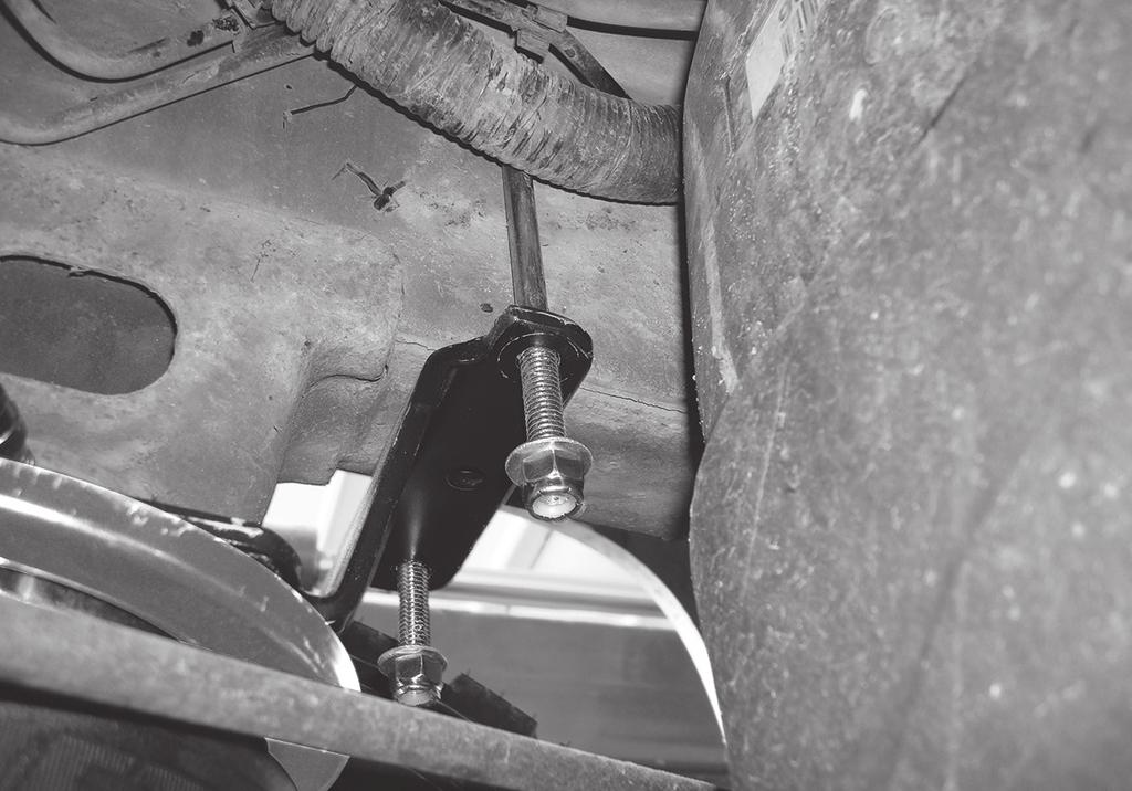 Set the new ABS line holder over the bolt once the upper bracket is in place and cap with a flat washer (S) and nylon locknut (R) (Fig. 18). Leave loose at this time. (S) (R) fig.