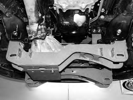 FIGURE 13B 47. Install the new differential skid plate to the front crossmember with ½ x 1-1/4 bolts and ½ SAE washers (BP #811) into the welded nuts in the crossmember.