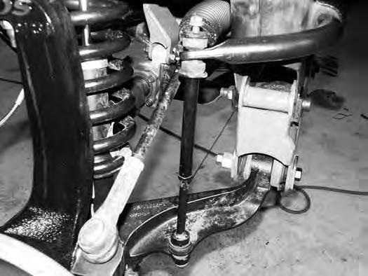 There should be no visible threads. Take care not to trim too much off from the male threads. 64. Attach the tie rod ends to the new steering knuckles with the OE nut. Torque to 55 ft-lbs. 65.