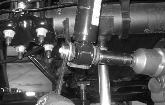 41. Working on the driver side, remove the shock from the upper and lower location. Save the shock and hardware.
