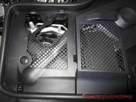 2. Front Suspension 1. Open the hood 2. Remove plastic strut tower cover on the driver side of the vehicle 3.