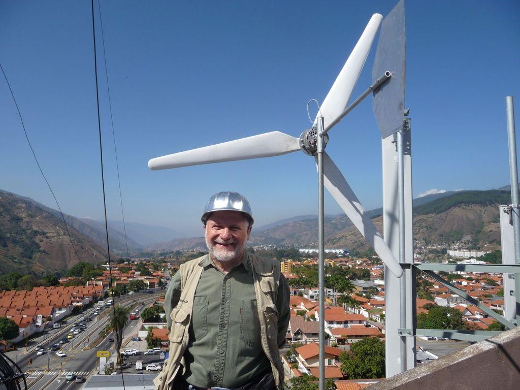 An inexpensive Wind generator can be built out of an automotive alternator connected to a suitable propeller.