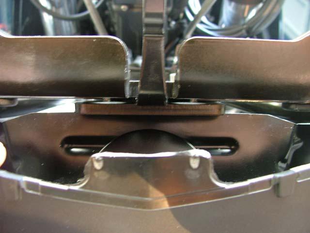 Line up the screw holes between the the aluminum spacers on top of T bracket and