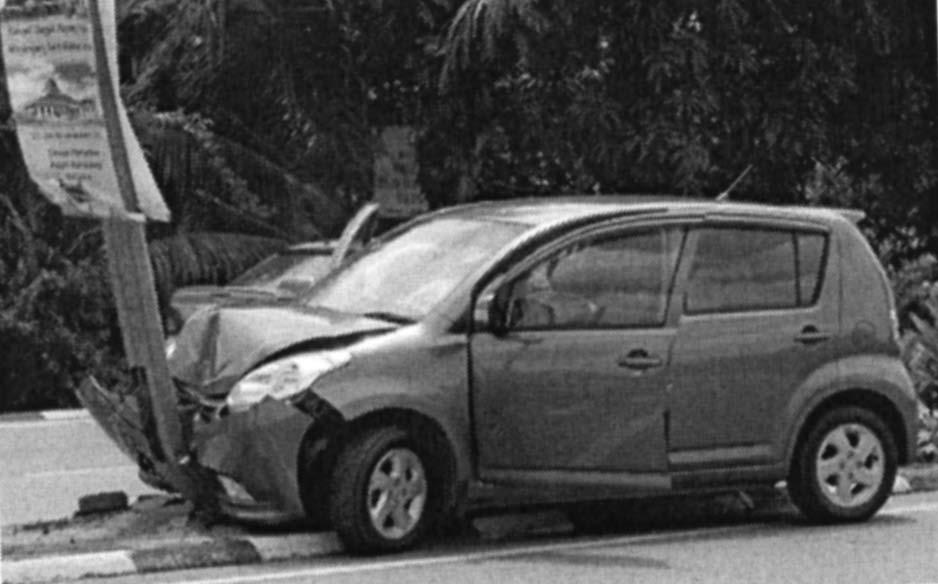 5 Examiner 3. The picture shows a car that was damaged in a head-on collision. The front of the car was designed to collapse to protect the driver and passengers.