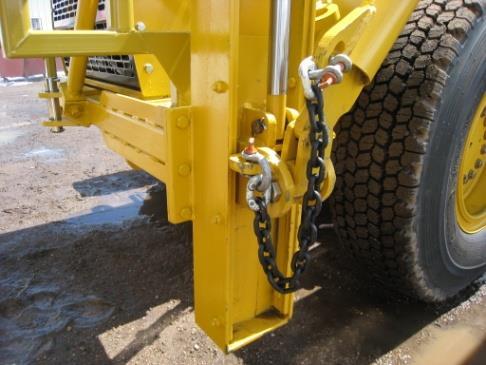 If there is a ripper on the grader, slide the ripper mount into the furthest scarifier slot and
