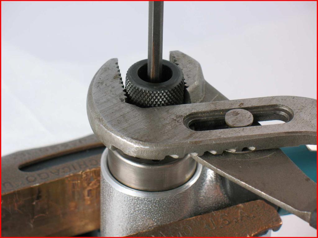 2. Carefully hold the 01447 Housing in a vise with aluminum or bronze jaws so