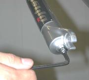 With a 5 mm hex wrench, loosen the shaft bolts five turns and firmly tap them with a plastic faced mallet to separate the shafts from the lower tubes.
