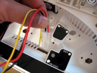 Pull any slack in all the wires through and lay the LED board flat inside the housing.