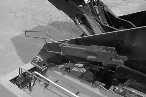 OPERATION ENGAGING HOPPER SUPPORT BAR (High Dump Model) 1. Press on the top part of the parking brake switch to set the parking brake.